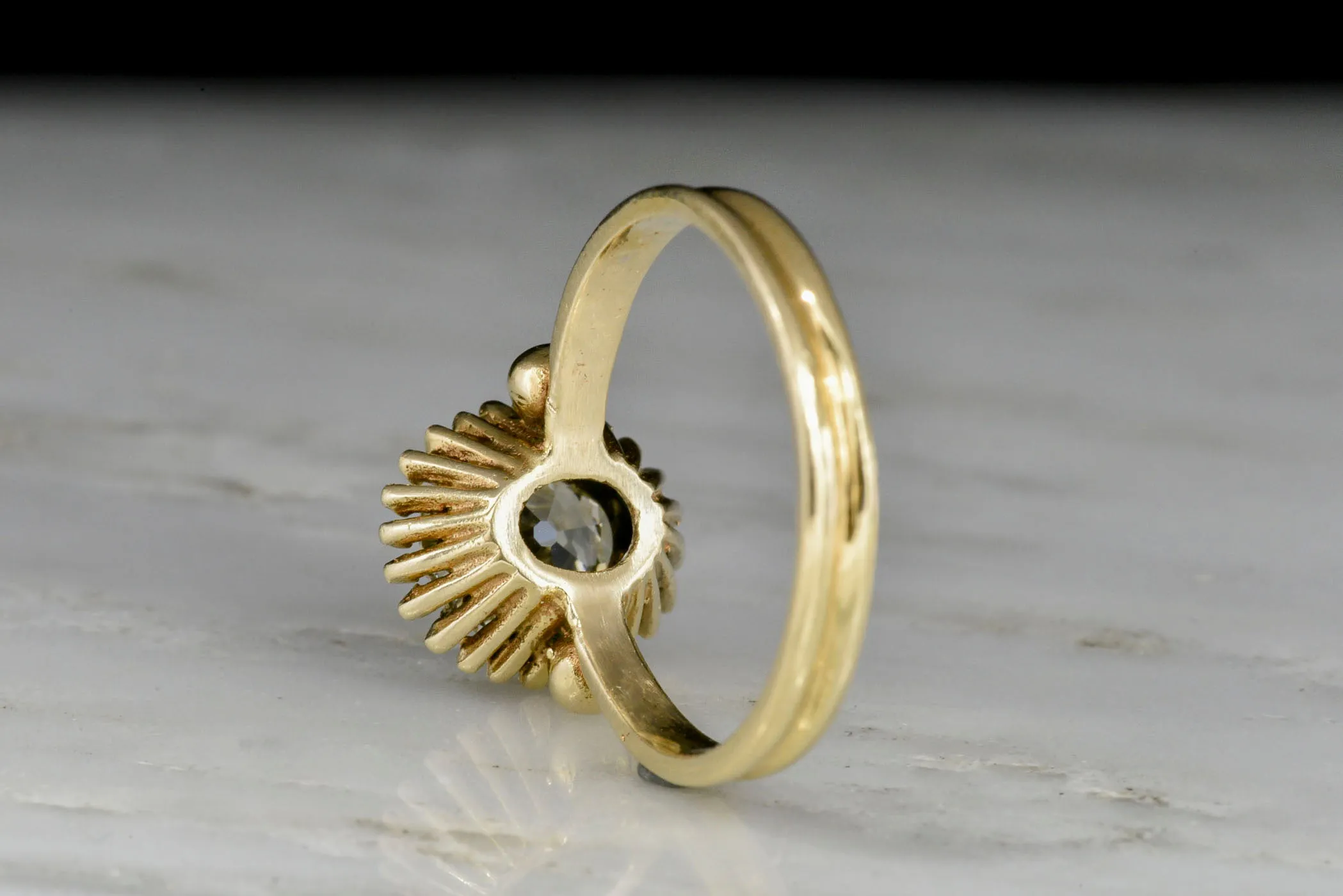 Unique Art Deco or Mid Century Gold Sunburst Ring with an Old Mine Cut Diamond Center