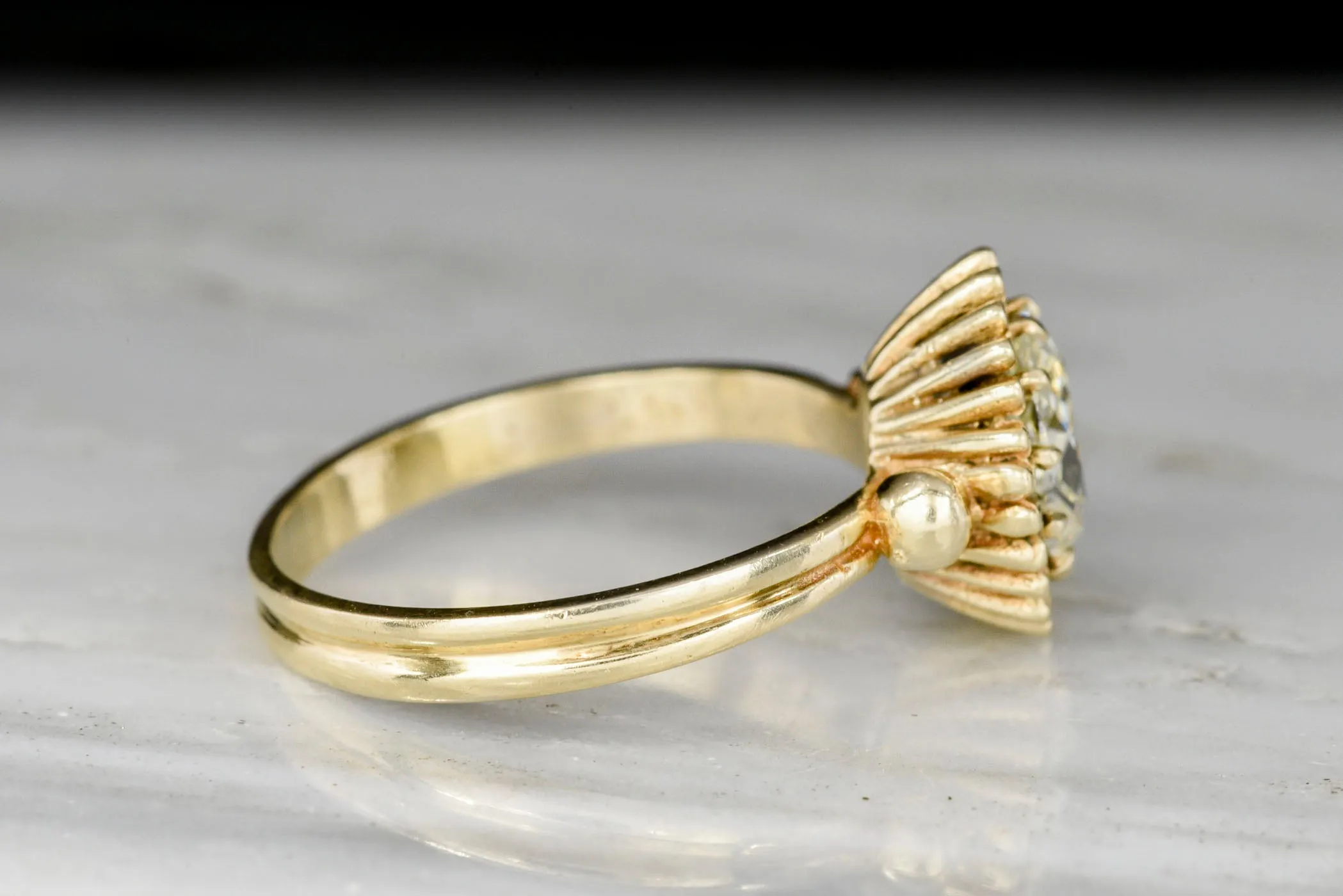 Unique Art Deco or Mid Century Gold Sunburst Ring with an Old Mine Cut Diamond Center